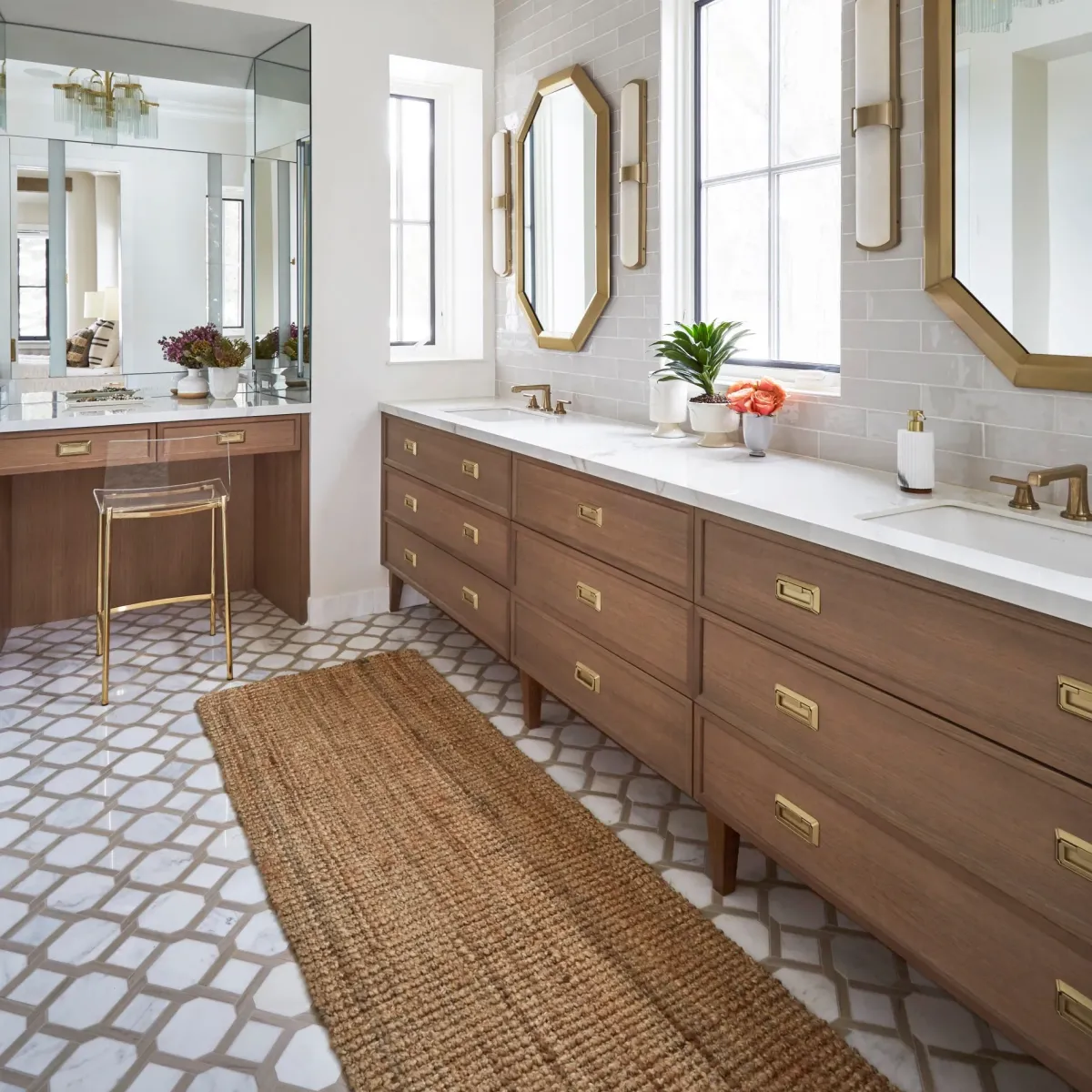Modern bathroom vanity in Vista California with marble countertops undermount sinks chrome fixtures wood cabinetry and natural light
