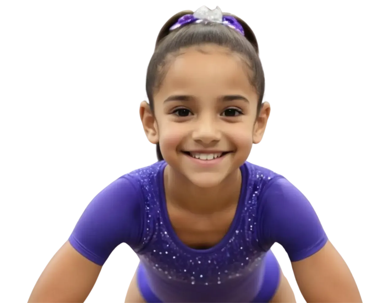 Confident gymnast celebrating with her arms raised after a successful routine in Irving, TX