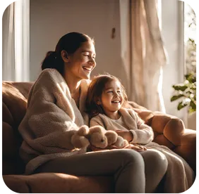 A reflective parent sitting on a couch, holding hands with their smiling daughter, symbolizing growth and understanding.