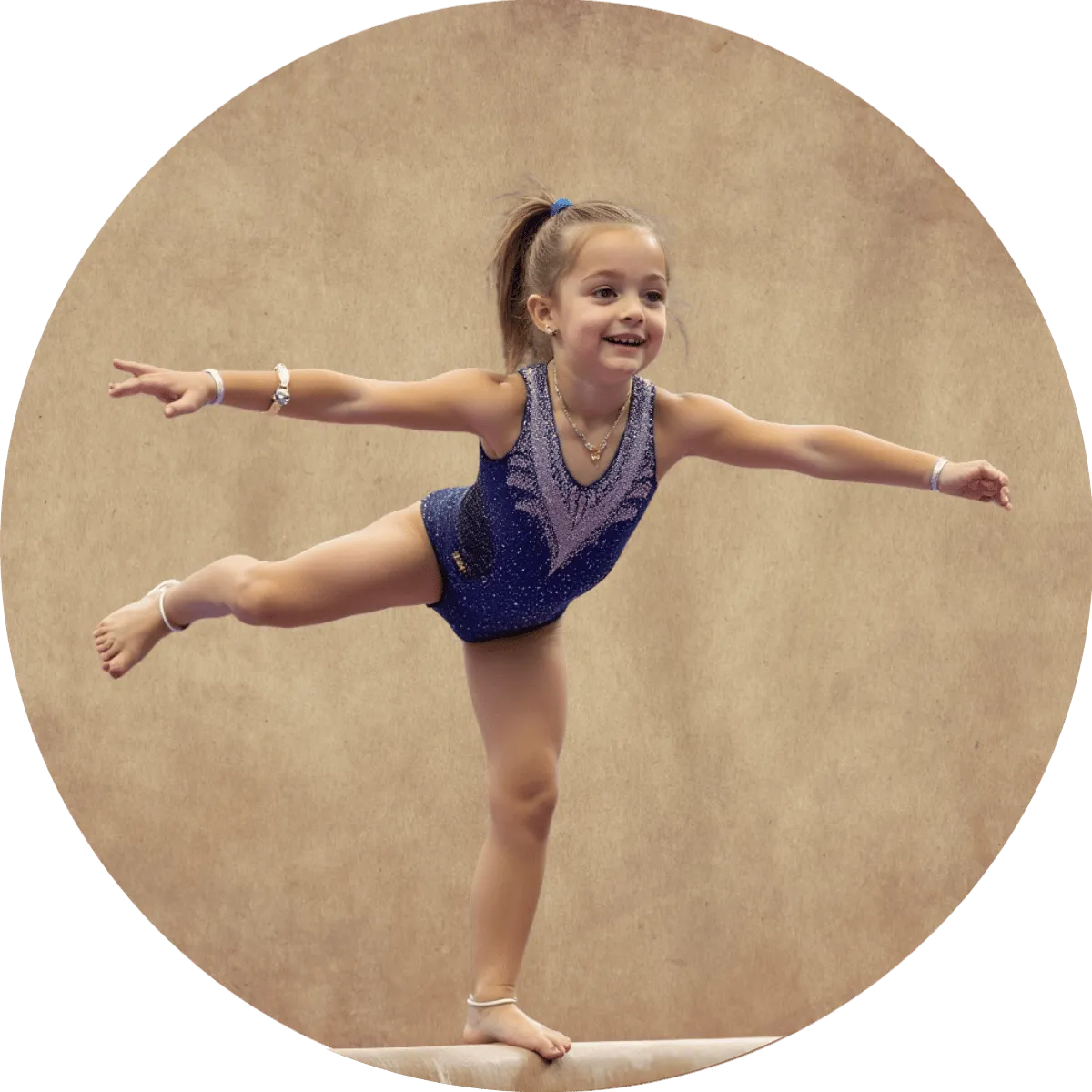 Young gymnast celebrating her progress with supportive teammates.