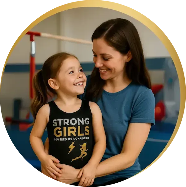 Three happy young girls in matching StrongGirls gymnastics leotards smiling with arms around each other, showing confidence and friendship