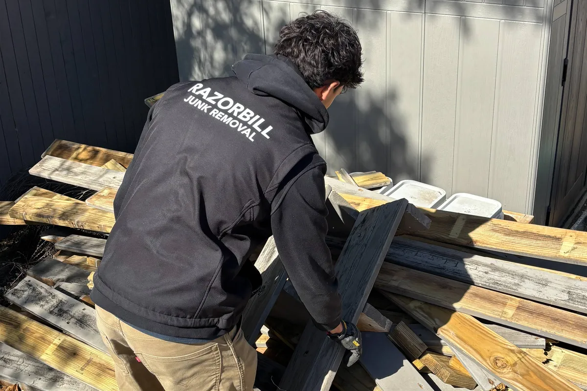 Guy Removing Scrap Wood In San Antonio