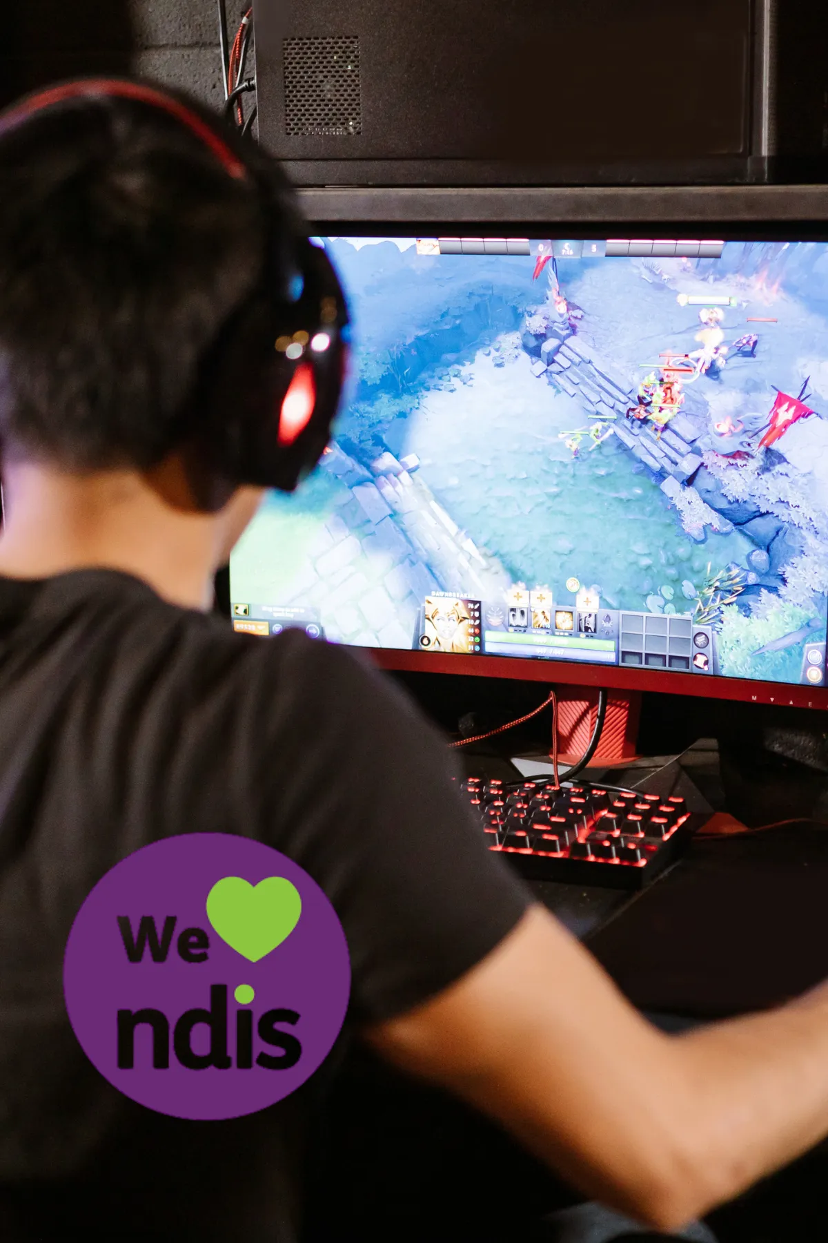 person using computer playing FPS game