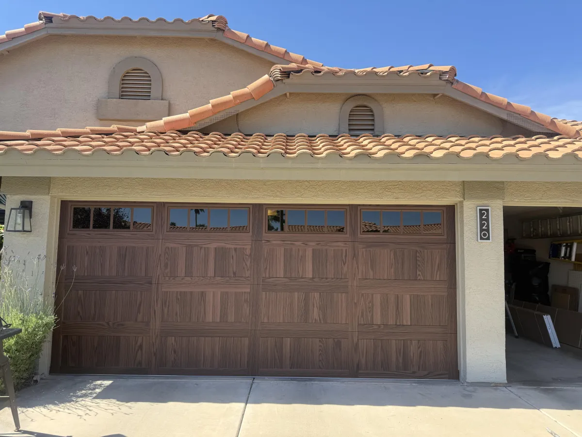 Garage door is covered with beautiful climbing roses.