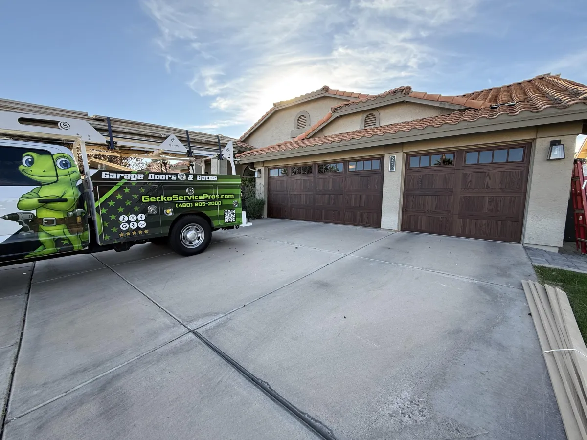 gray wooden door near green plants during daytime