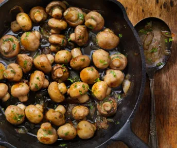 Award winning pizza dough being stretched by hand