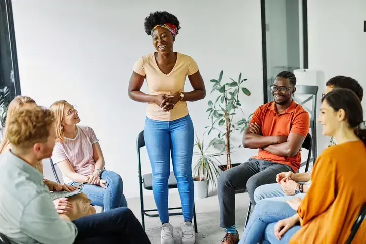 A facilitator leading a supportive community circle.