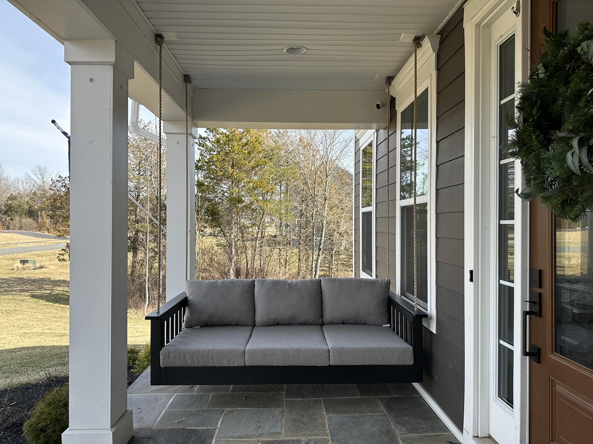 Exterior home renovation with new siding and fresh paint