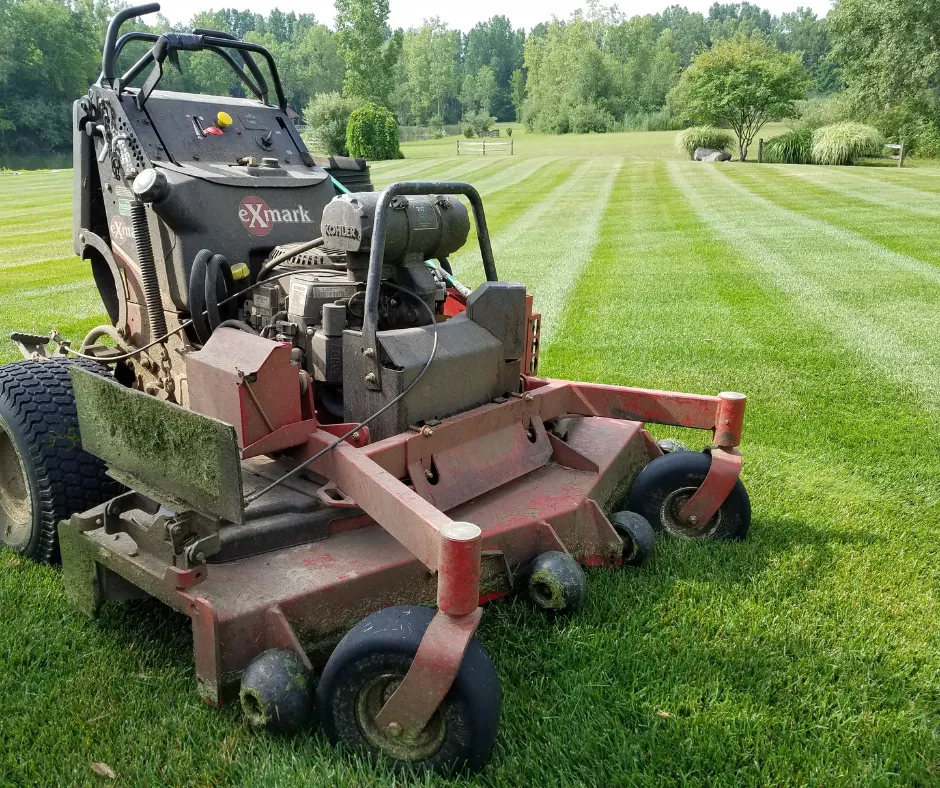 Team performing Lawn Mowing on a residential property as a part of professional Lawn Care services by Jhdlawncare LLC in Elyria.