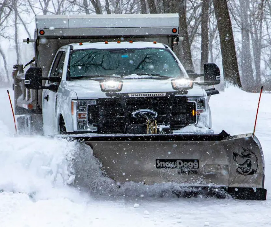 Team performing Snow Plowing to clear large areas efficiently as a part of reliable Snow Management Services by Jhdlawncare LLC in Elyria.