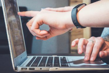 Two people working on a laptop symbolises the collaboration and efficiency behind Northstar’s automation and AI services Bristol.