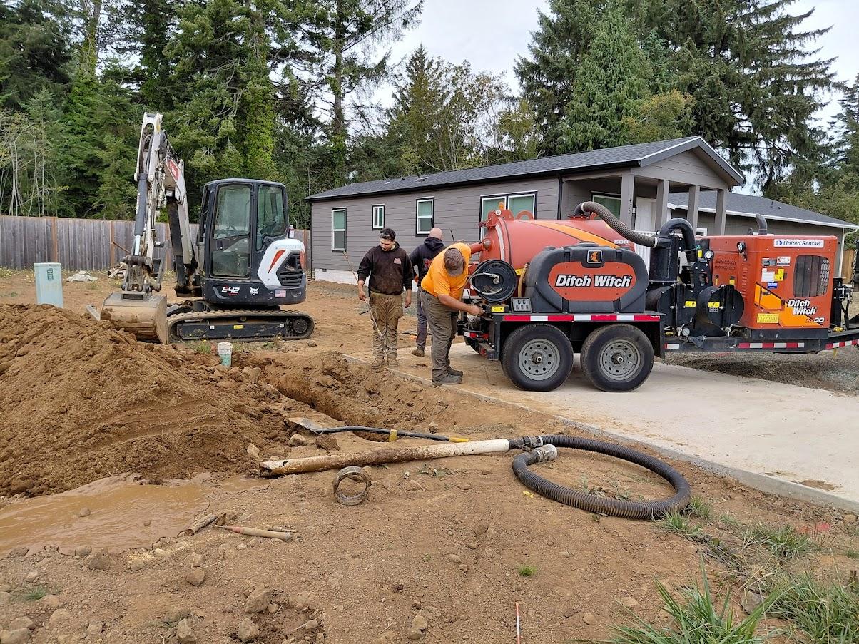 Econo Rooter Services equipment at a Gold Beach job