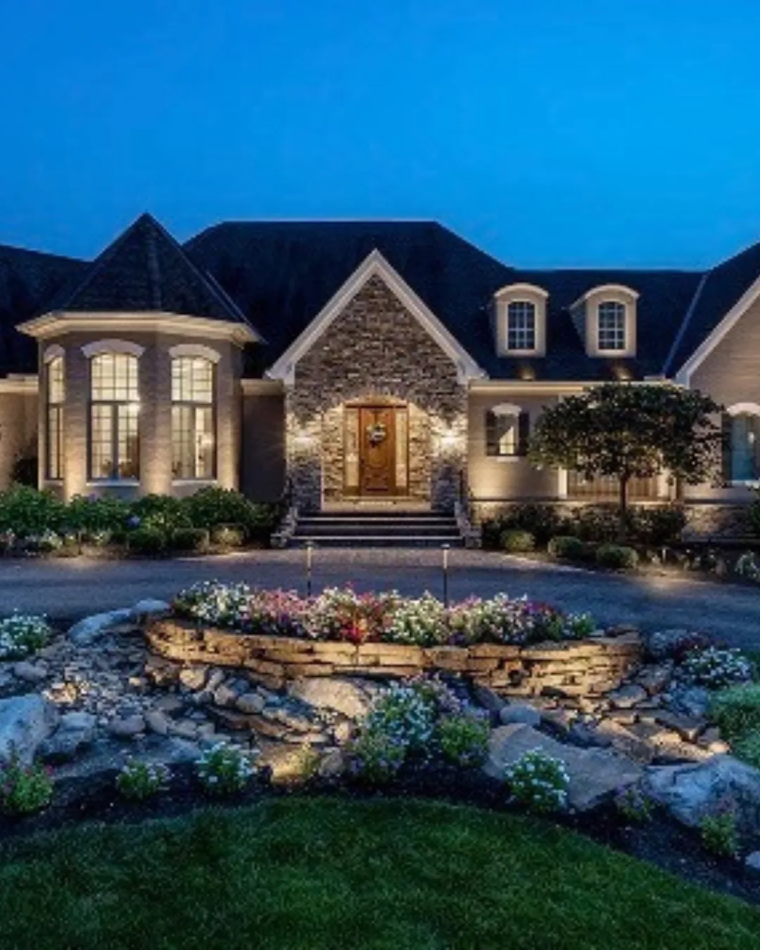 Landscape lighting with path lights and uplighting installed in Oakland County, MI