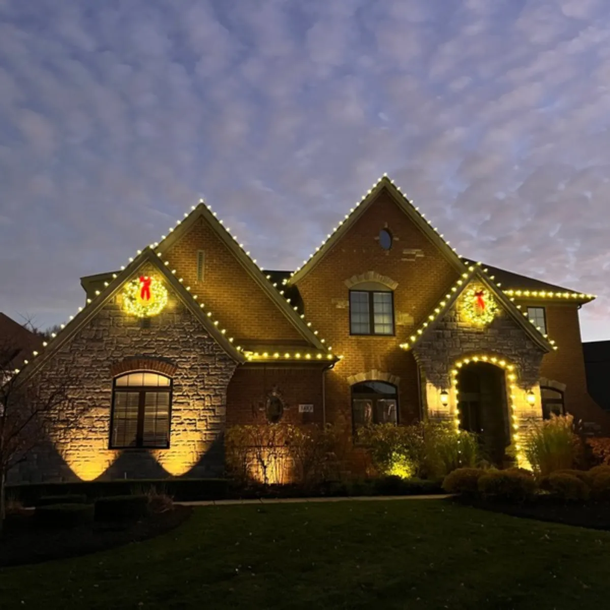 Landscape lighting with path lights and uplighting installed in Oakland County, MI