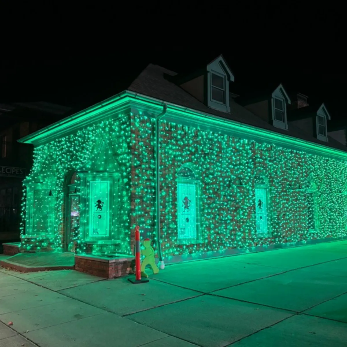 Commercial Christmas wall lights on storefront in downtown Rochester, MI
