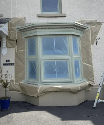 A bay window that we taped up ready for spraying