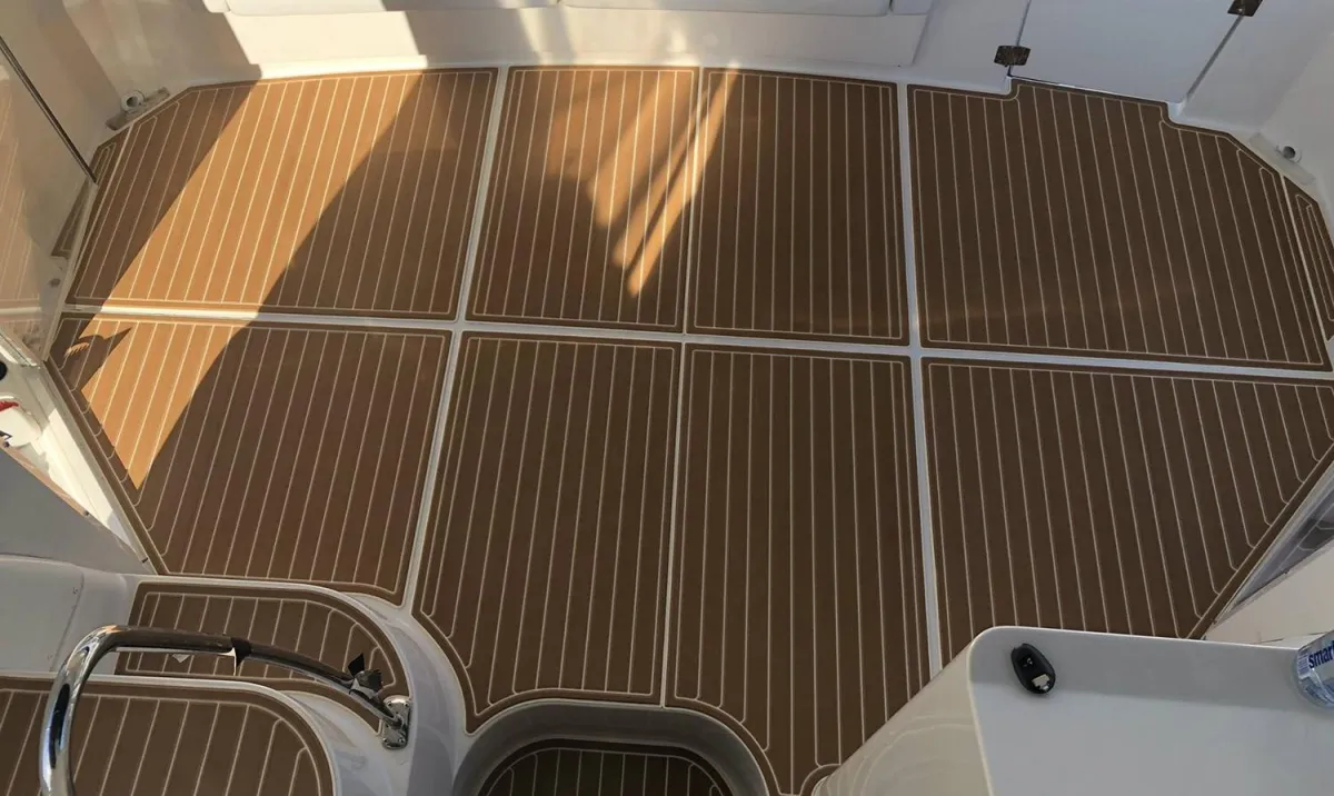 birds eye photography of boat on body of water