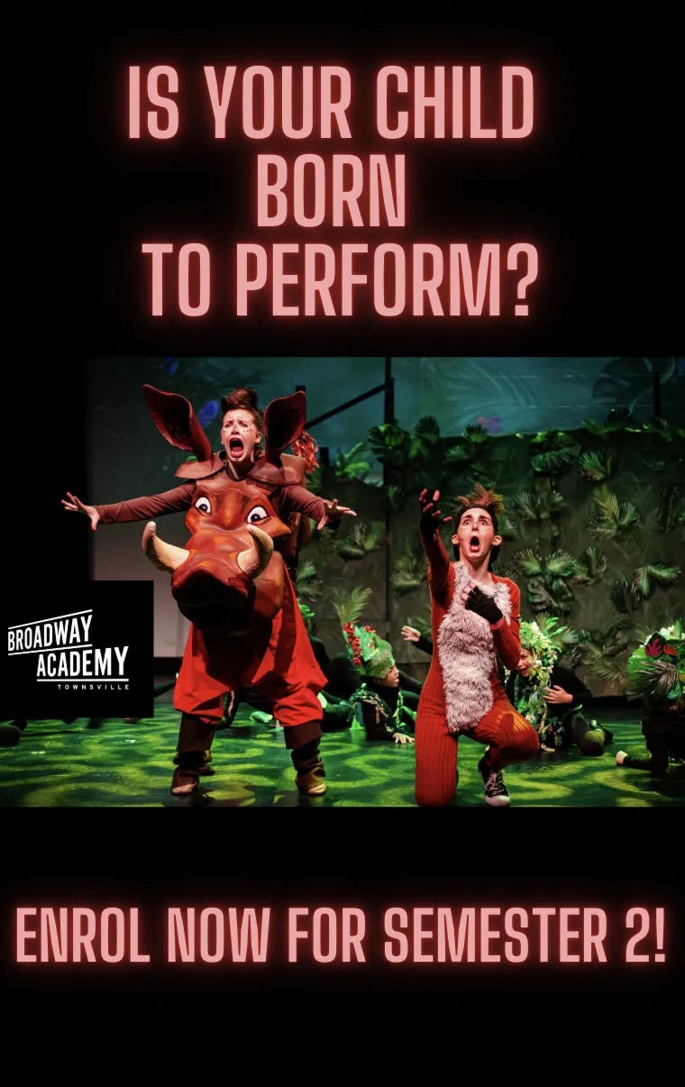 Shrek the musical on stage with kids dressed up in costume.