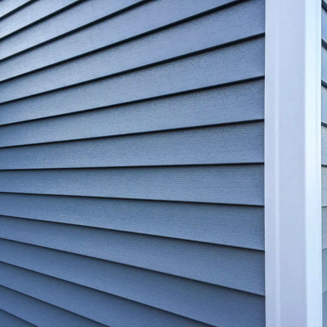 Blue horizontal siding and white trim