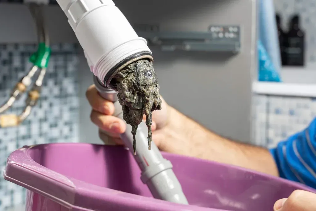 two person fixing AC motor