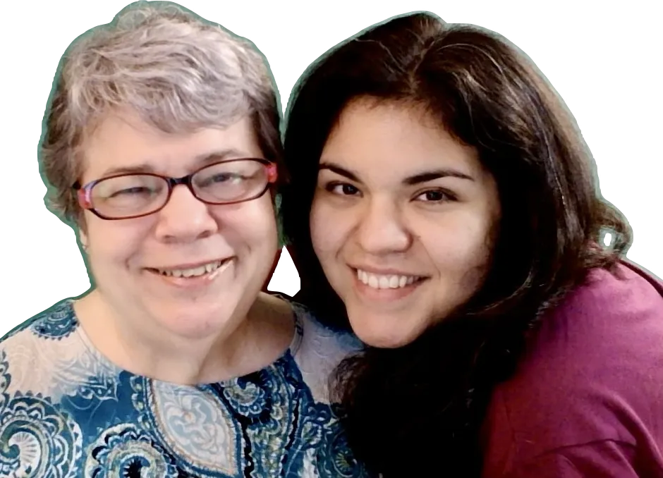 Headshot photo of Jackie Ambrow and Xochitl Suriano Ambrow. Jackie has short graying hair, wears glasses and a teal colored paisley print top. Xochitl has long dark, wavy hair and striking features. She's wearing a cranberry colored top. Both are smiling broadly.