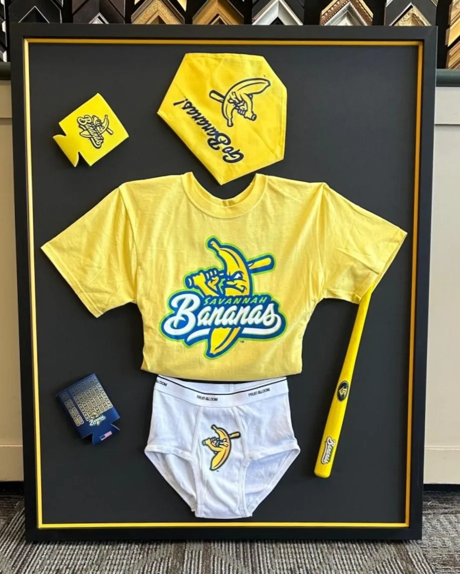Custom framed Savannah Bananas sports memorabilia display created by Friedman’s Framing in Savannah, GA
