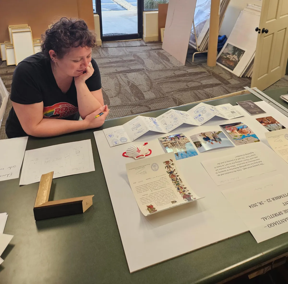 Staff designing a custom memorabilia framing layout at Friedman’s Framing in Savannah, GA