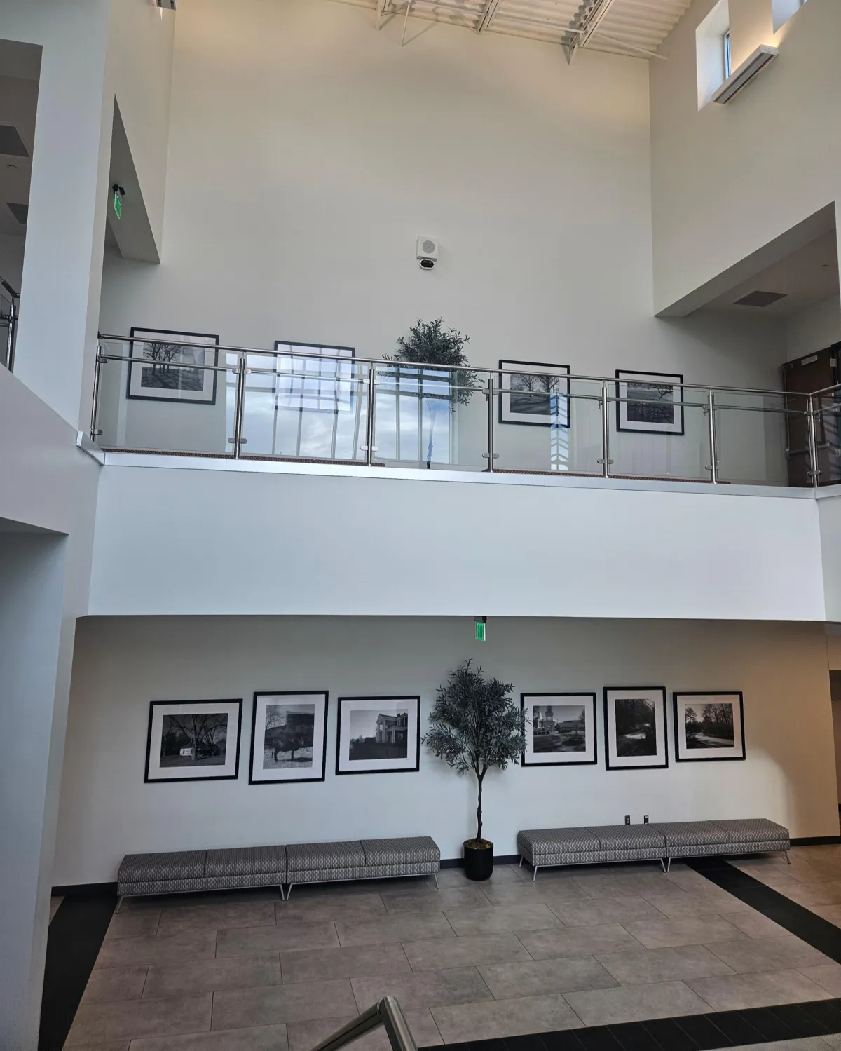 Commercial art installation project featuring professionally mounted framed artwork in a modern office and corporate lobby environment.