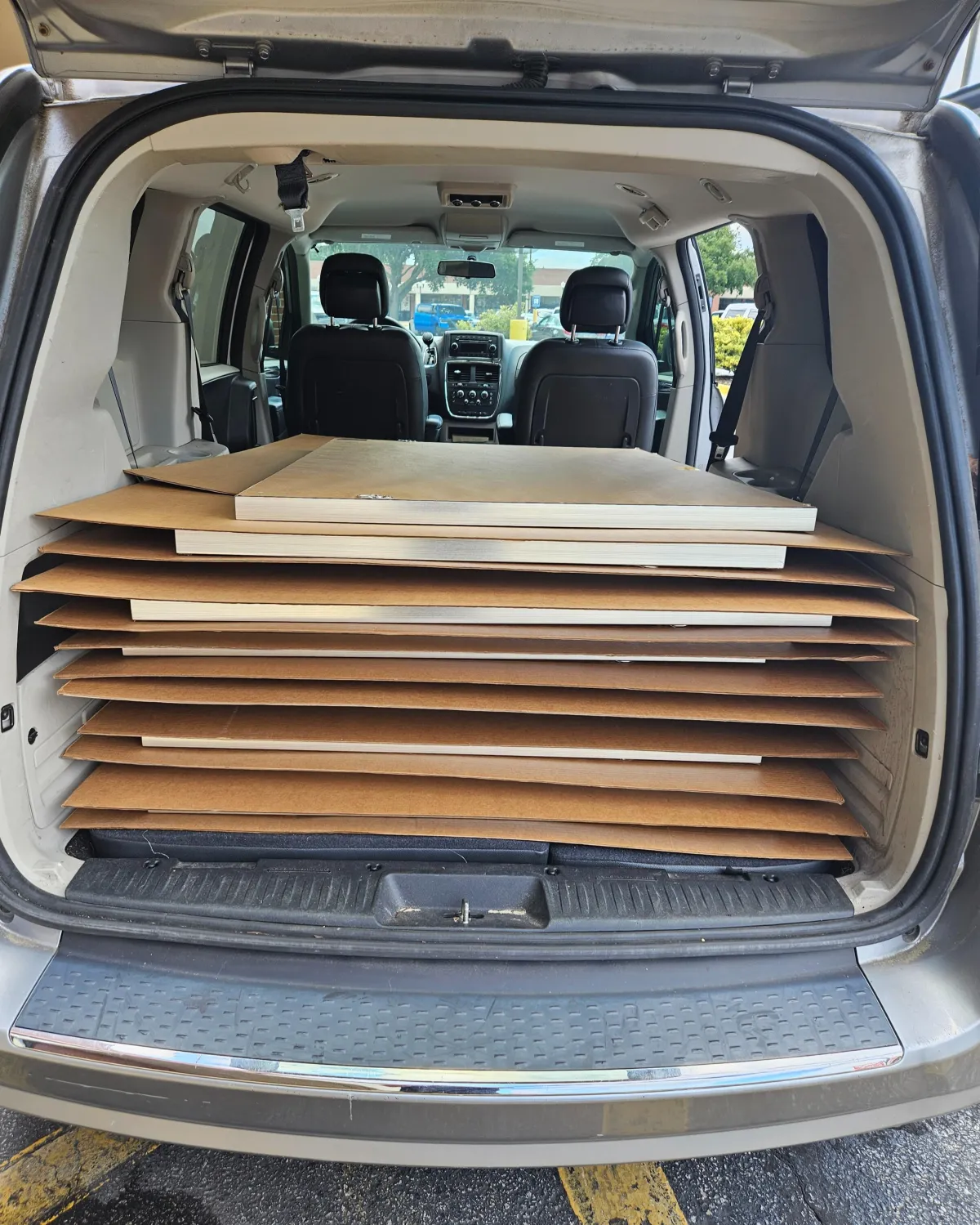 Professional artwork transport and installation preparation for framed and unframed art pieces in Savannah, GA using protective spacing and secure handling methods.
