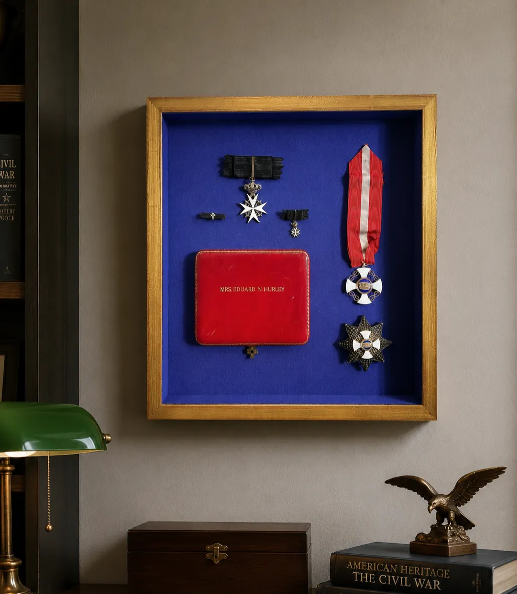 Custom framed military memorabilia shadow box displayed in a traditional office interior by Friedman’s Framing in Savannah, GA