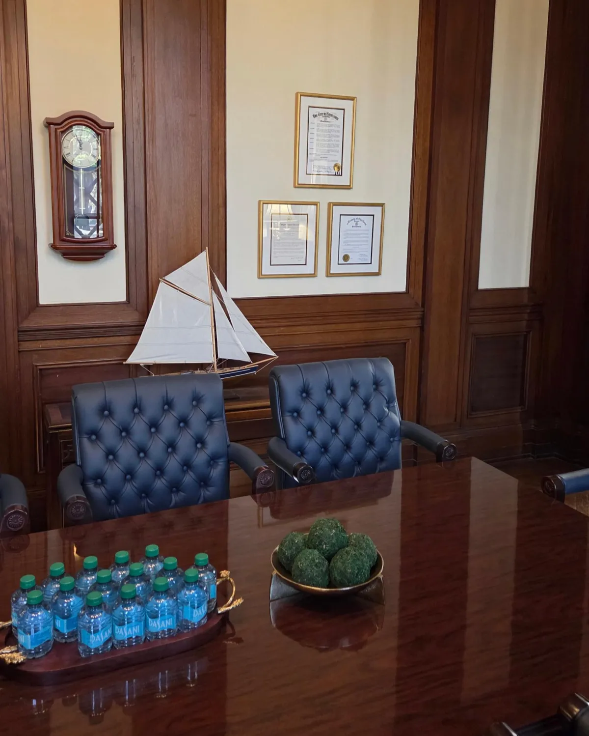 Professionally framed diplomas and certificates displayed in a traditional office interior by Friedman’s Framing in Savannah, GA