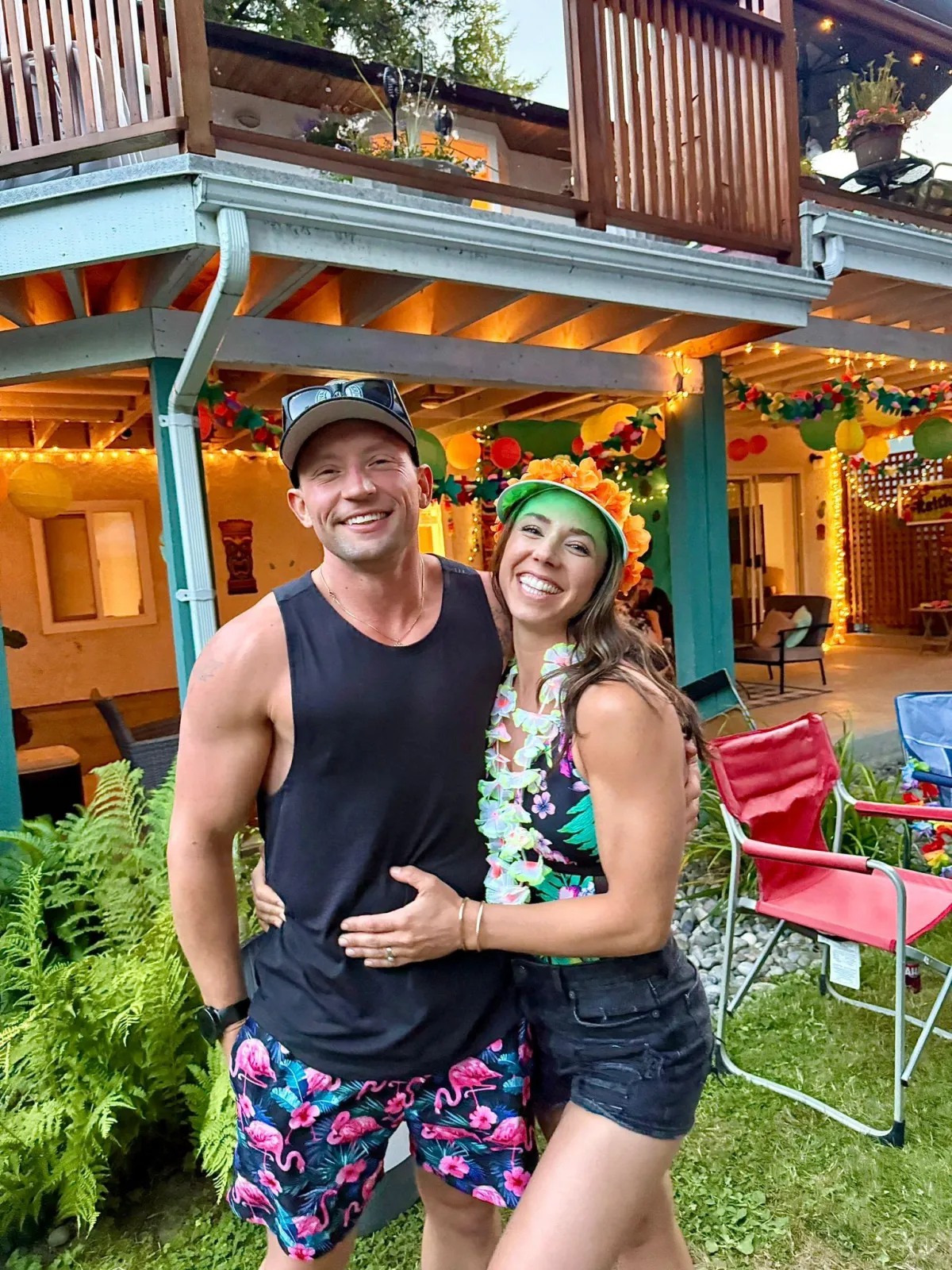 Two people doing yoga in a park.