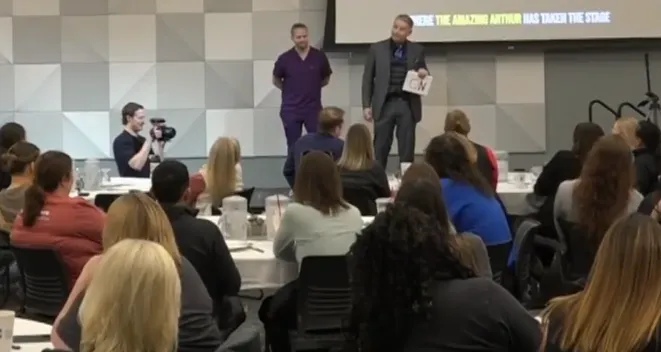 Omaha keynote speaker Amazing Arthur with volunteer Tim at Nebraska Cancer Specialists