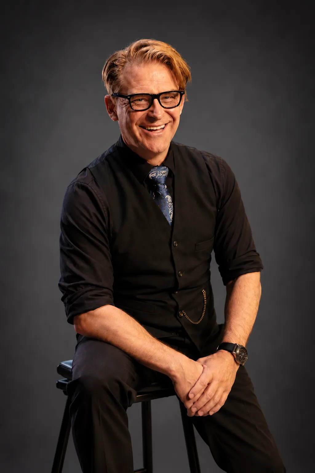 Cinematic studio portrait of Arthur Fratelli against a dark stage atmosphere