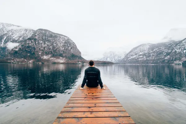 man sitting on deck