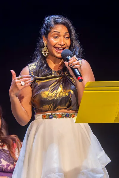 Women talking holding a microphone