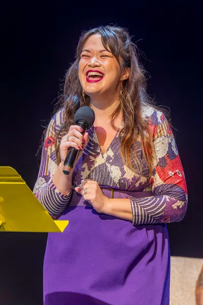 Laughing Woman holding microphone