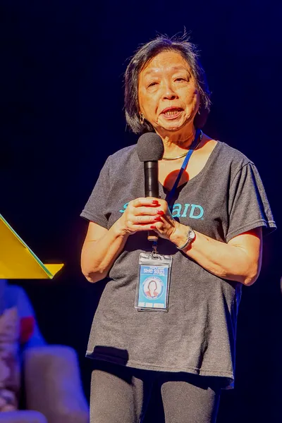 Women talking holding a microphone