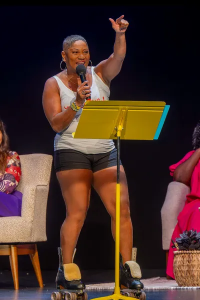 Women in roller skates with a microphone