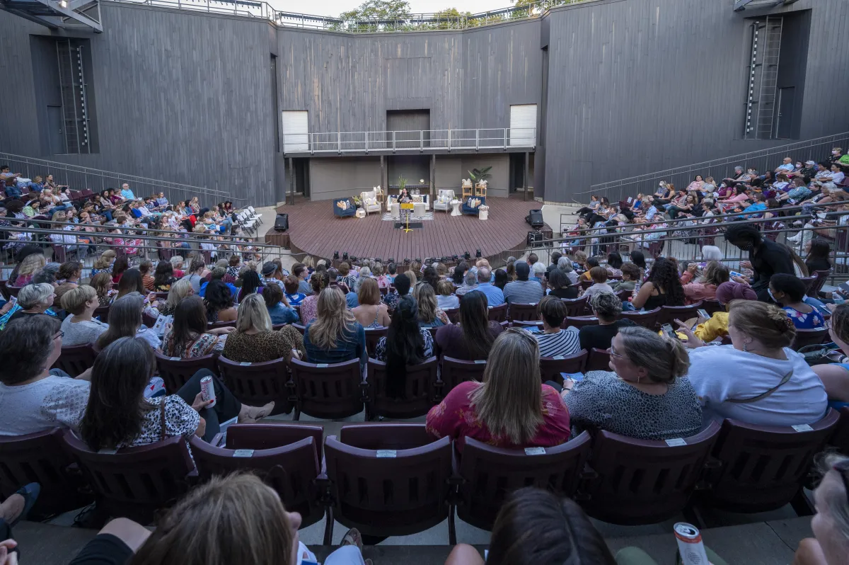 Image of a crowd in an amphitheater watching a TWSS performance