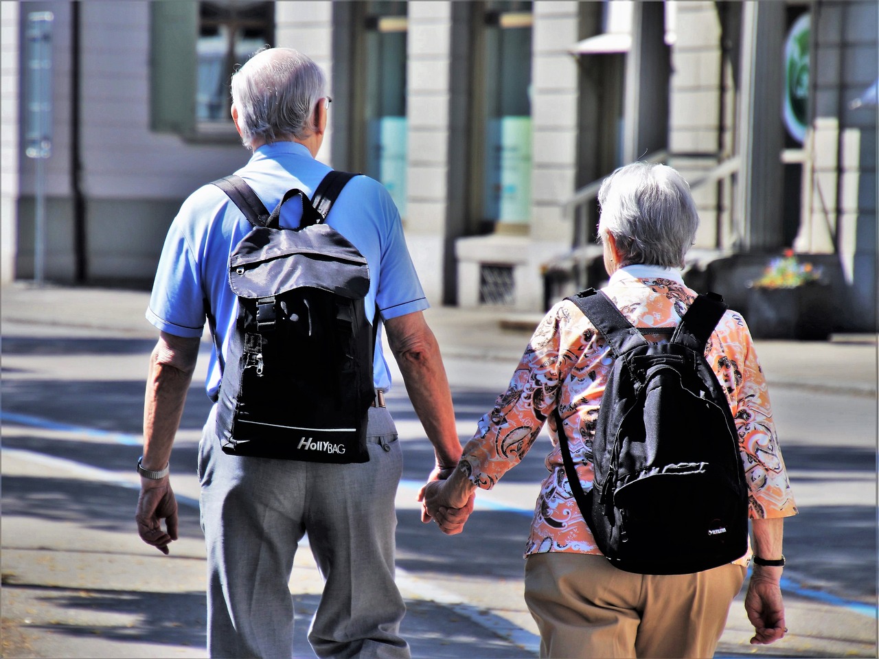 two person holding papercut heart