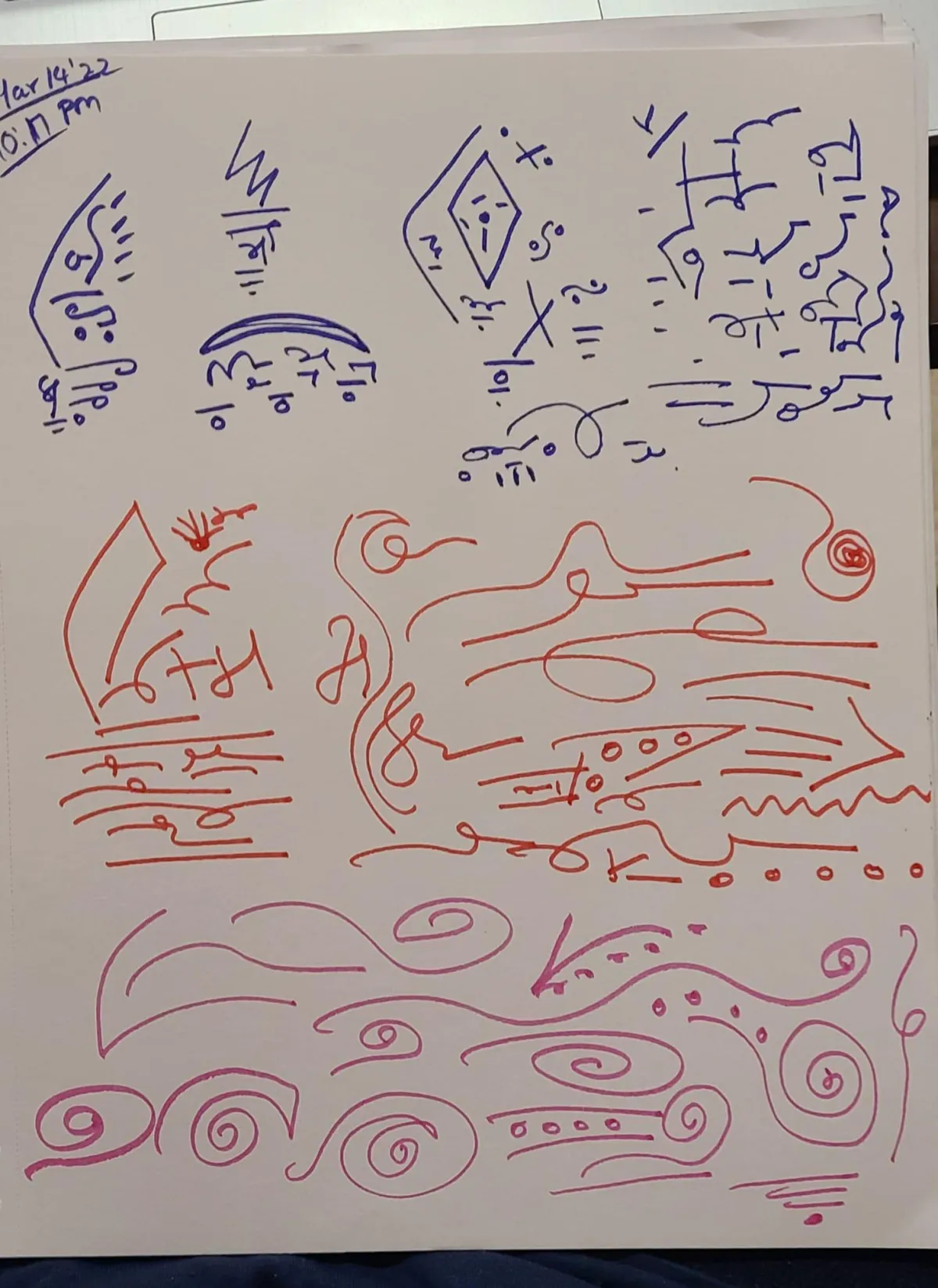 A woman looks to the side in the dark.