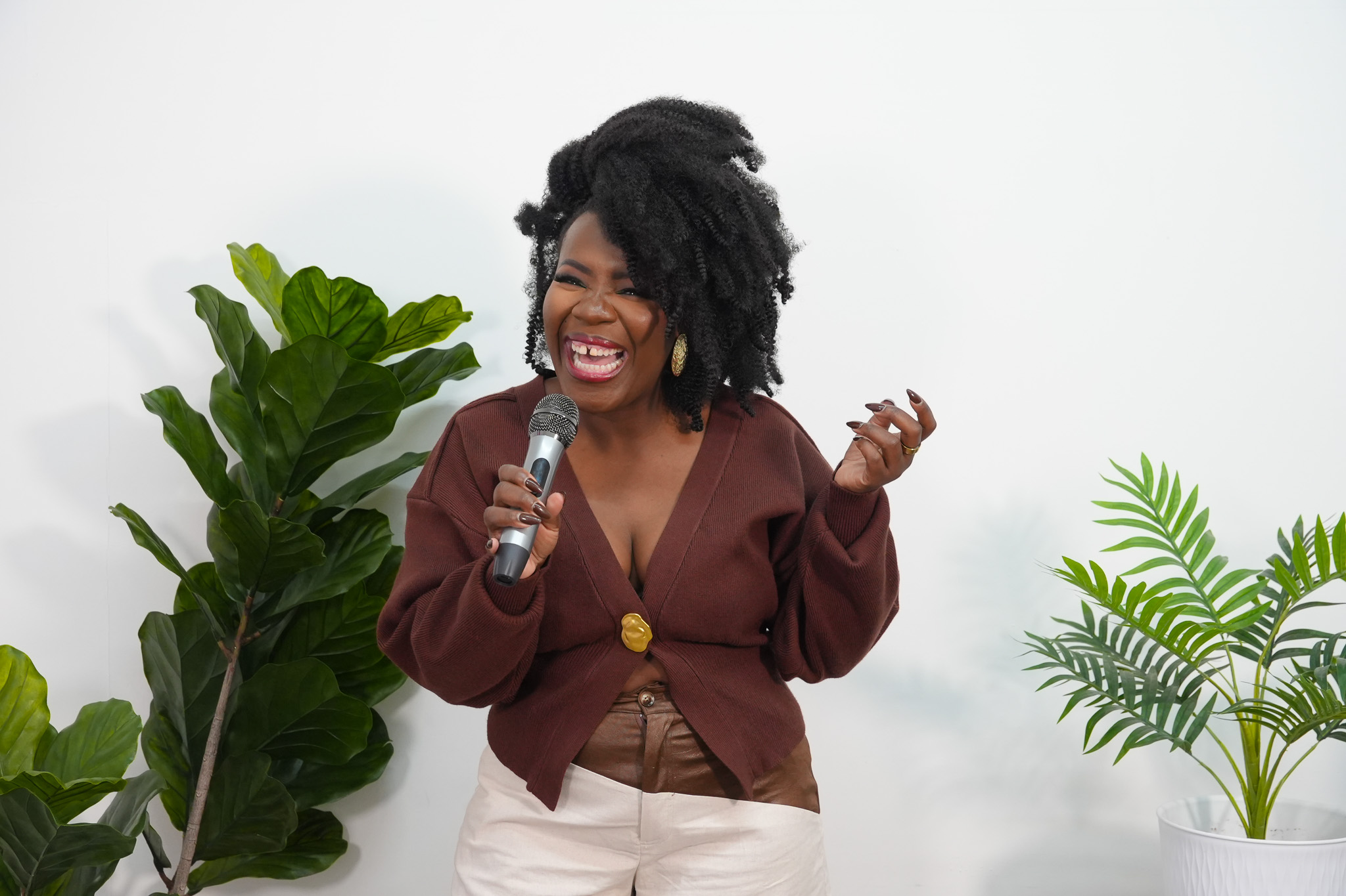 Nadege Fleurimond Smiling holding a mic