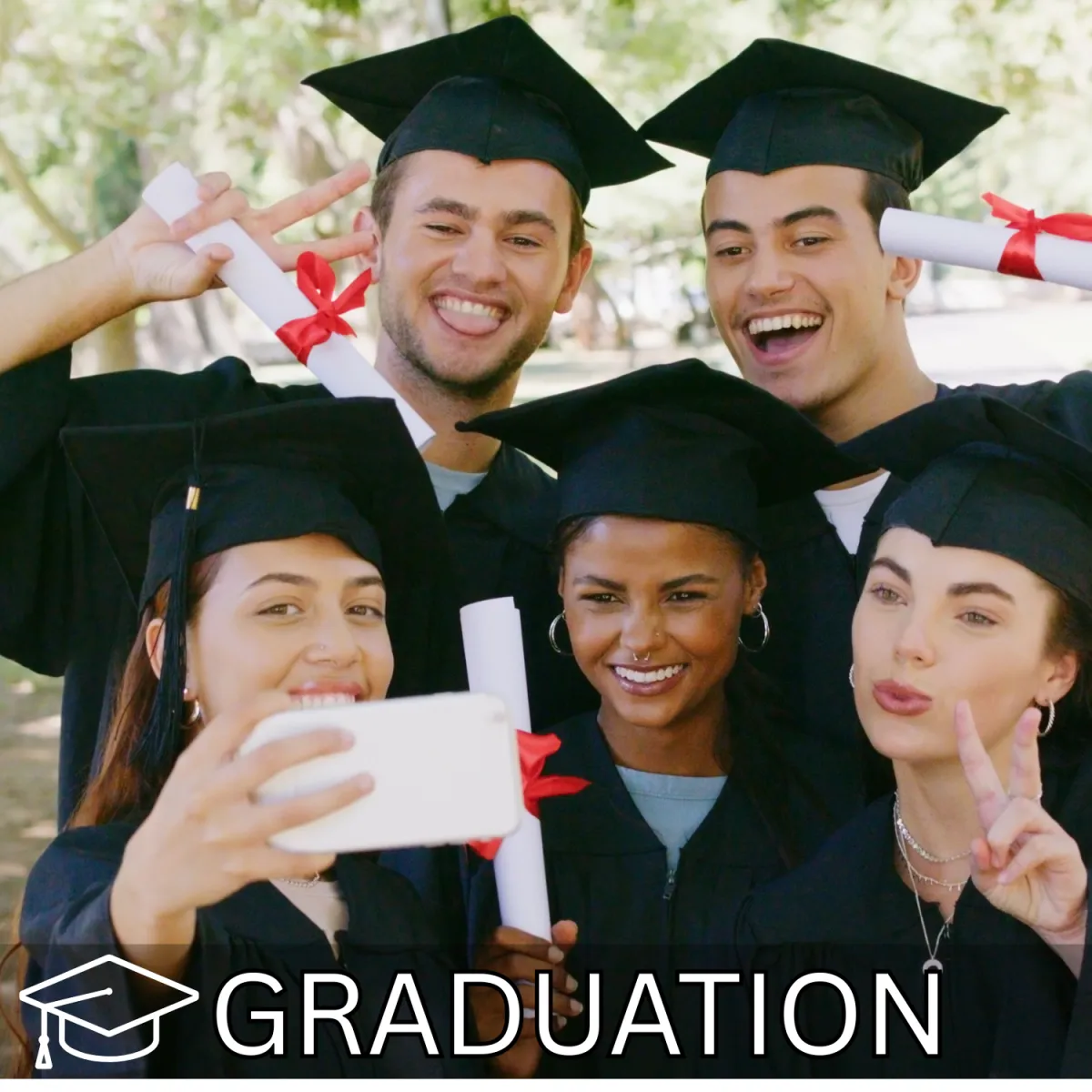 Group of graduates celebrating together in caps and gowns