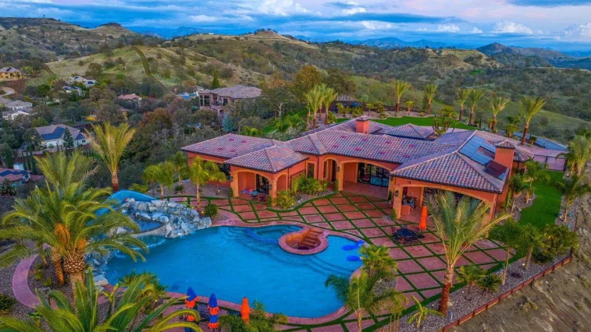 people swimming in pool during daytime