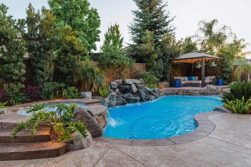 people swimming in pool during daytime