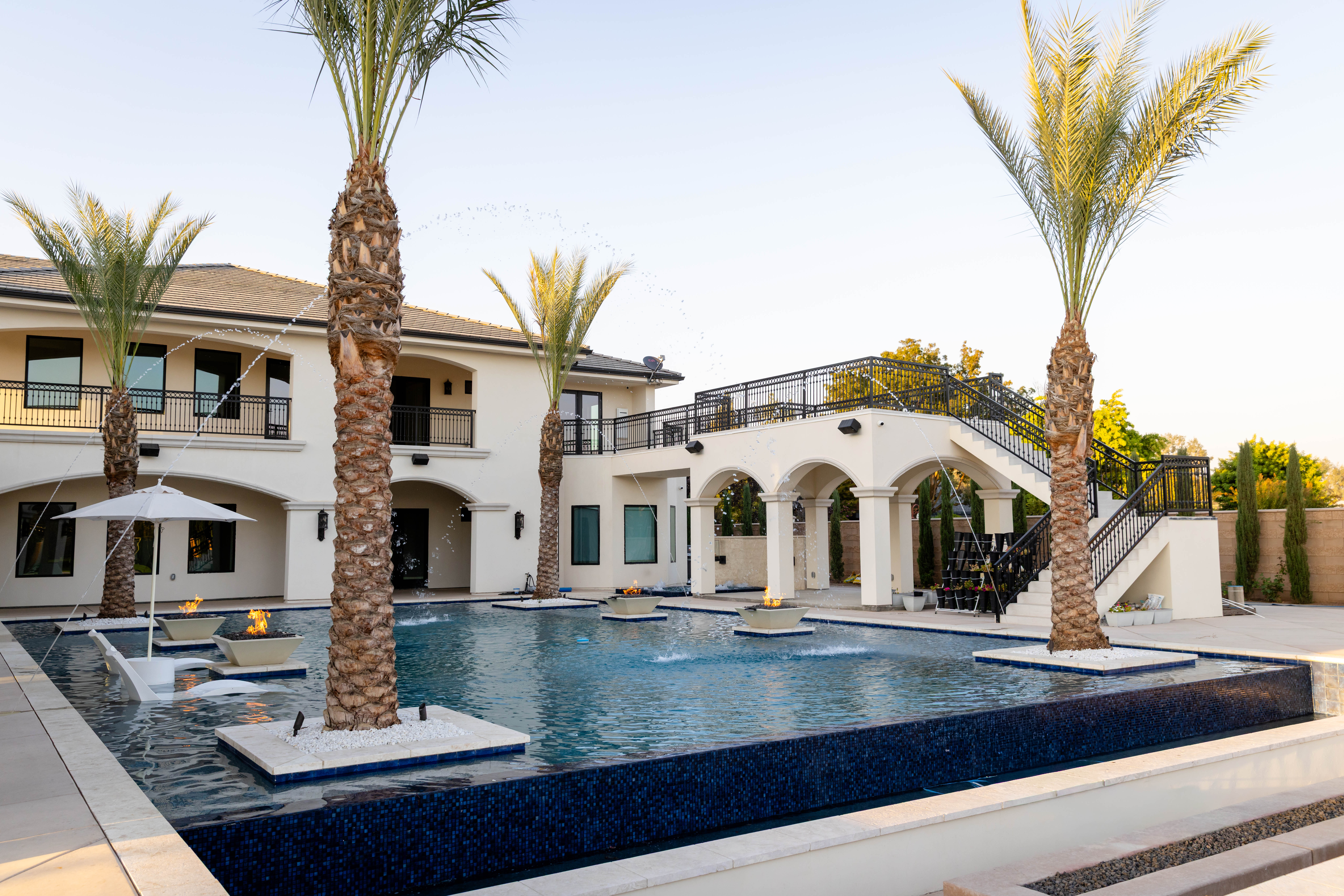 people swimming in pool during daytime