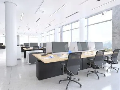 High-end office renovation in NYC, with ergonomic workstations, sleek furniture, and improved lighting.