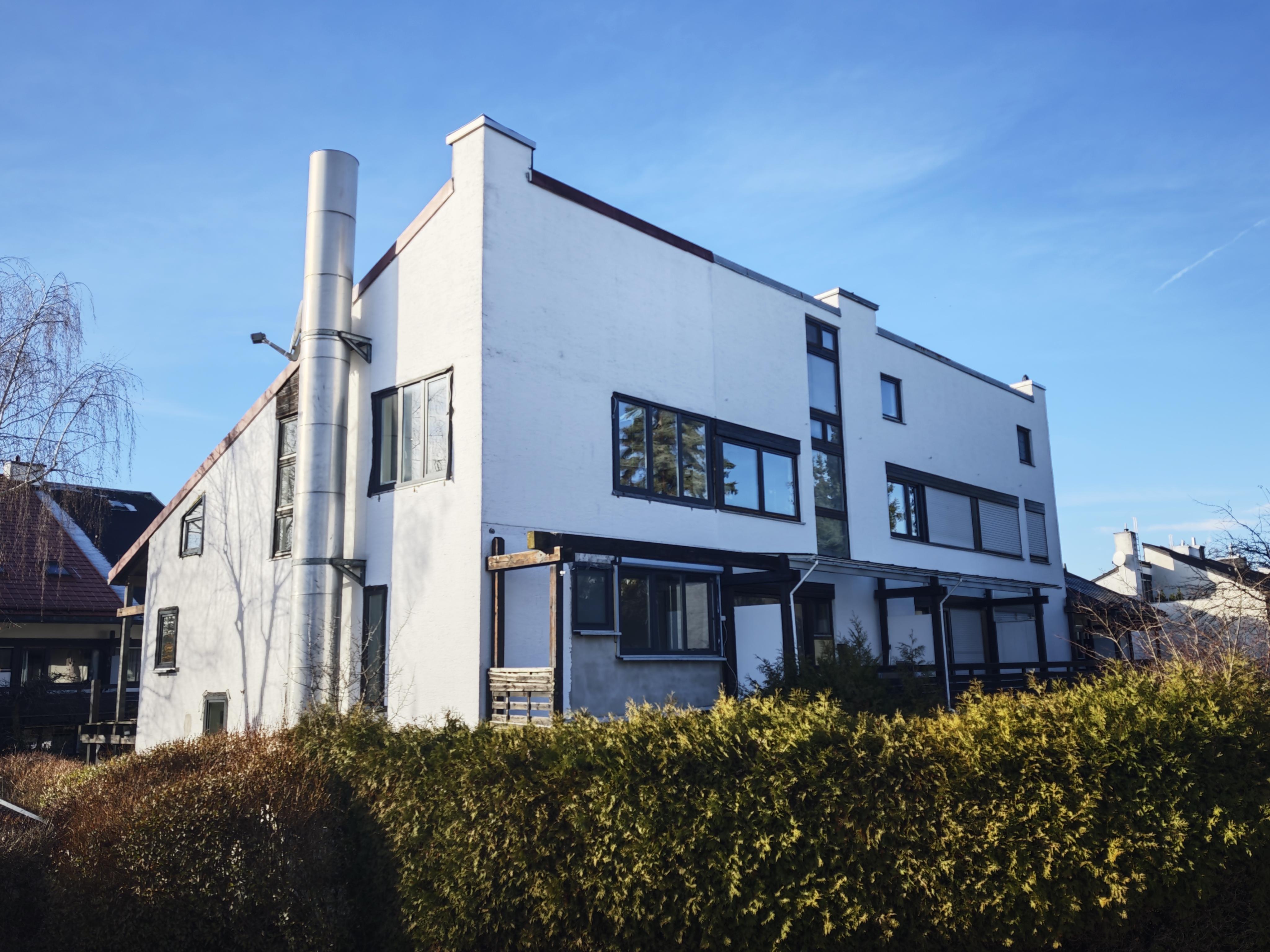 a close up of a mouse on a white surface