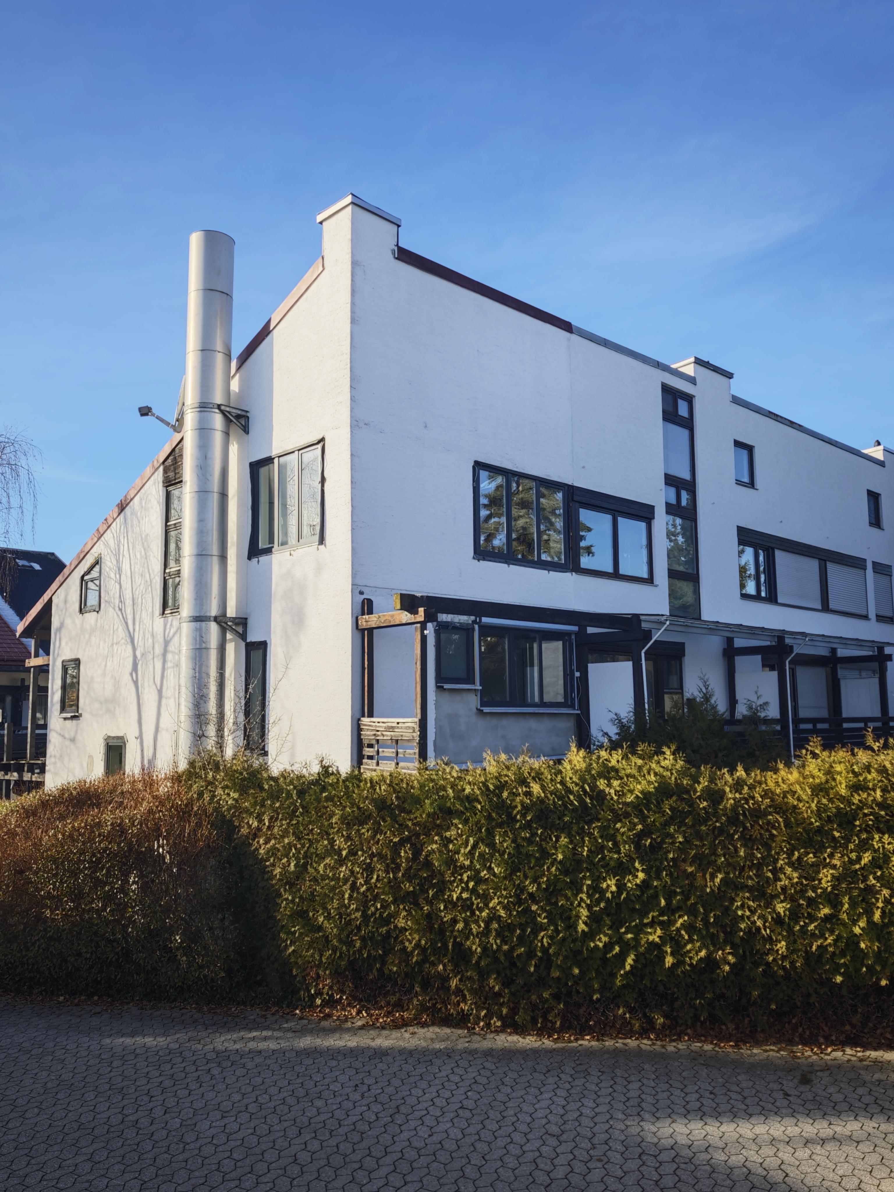 a close up of a mouse on a white surface